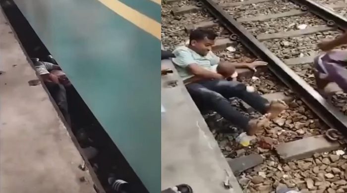 চলন্ত ট্রেনের নীচে পড়েও অলৌকিকভাবে বাঁচল পিতা-পুত্র